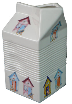 Milk carton shaped jug off white ceramic decorated with colourful beach huts