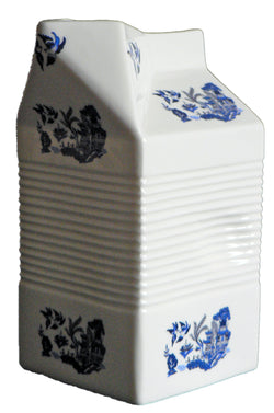 Milk carton shaped jug off white ceramic decorated with blue willow pattren