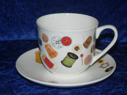Bone china cup and saucer set decorated with a fun sewing/needlework design